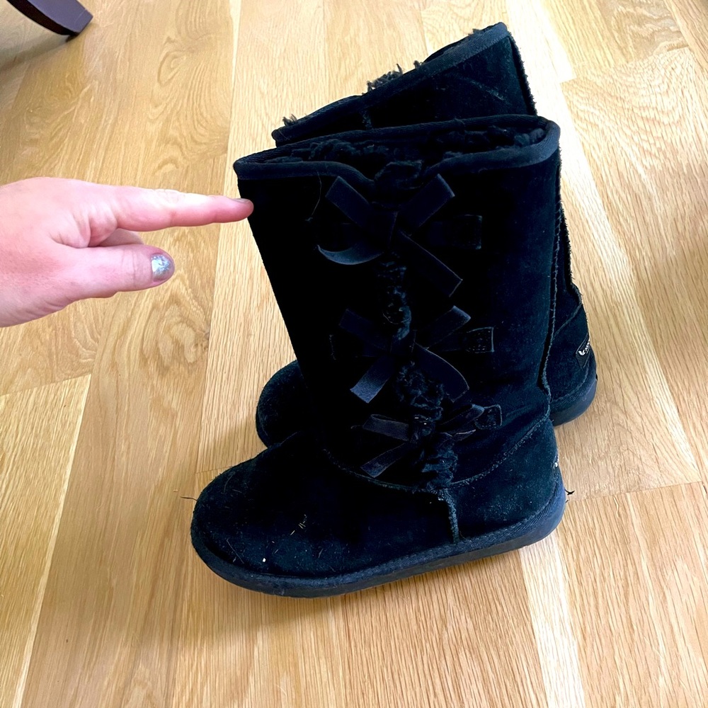 Size 6 black boots with ties on the side
